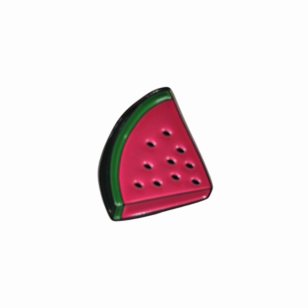 Watermelon Slice Pin Brooch - Free Palestine A slice of watermelon with a green rind and pink flesh with small black seeds.