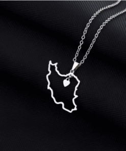Close up image of Iran Map Necklace in Silver, against black background